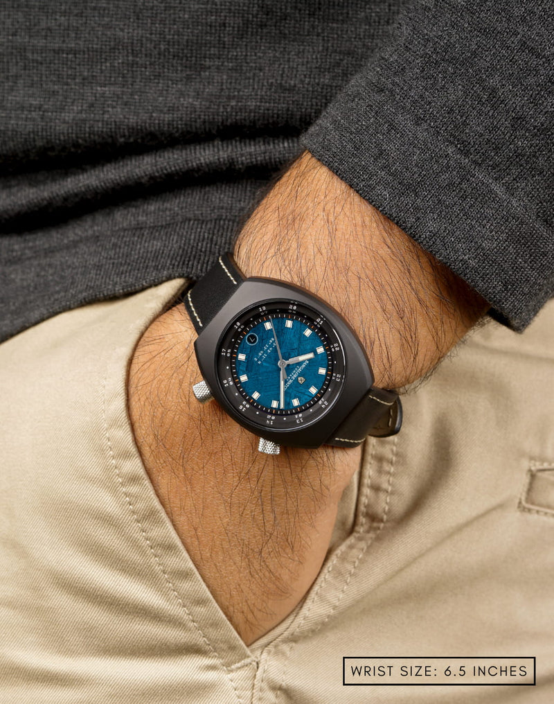 Man wearing Karman Line wristwatch with hand in pocket, showcasing the watch's stylish design and sleek fit.